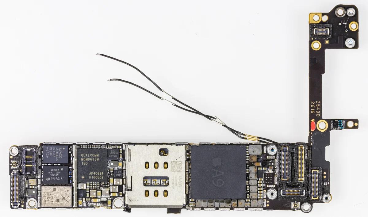 Close-up of an iPhone 6s motherboard showing the dense layout of chips and connectors that corrosion can damage