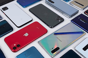 Stack of modern high-end smartphones in various colors